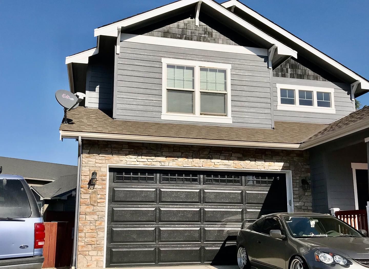Gray two-story home and garage exterior painted by R Painting