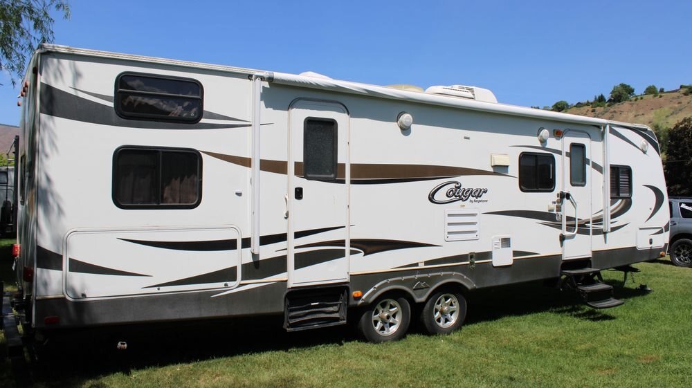 Cougar fifth wheel trailer parked outdoors, available to rent from Wenatchee RV Rental