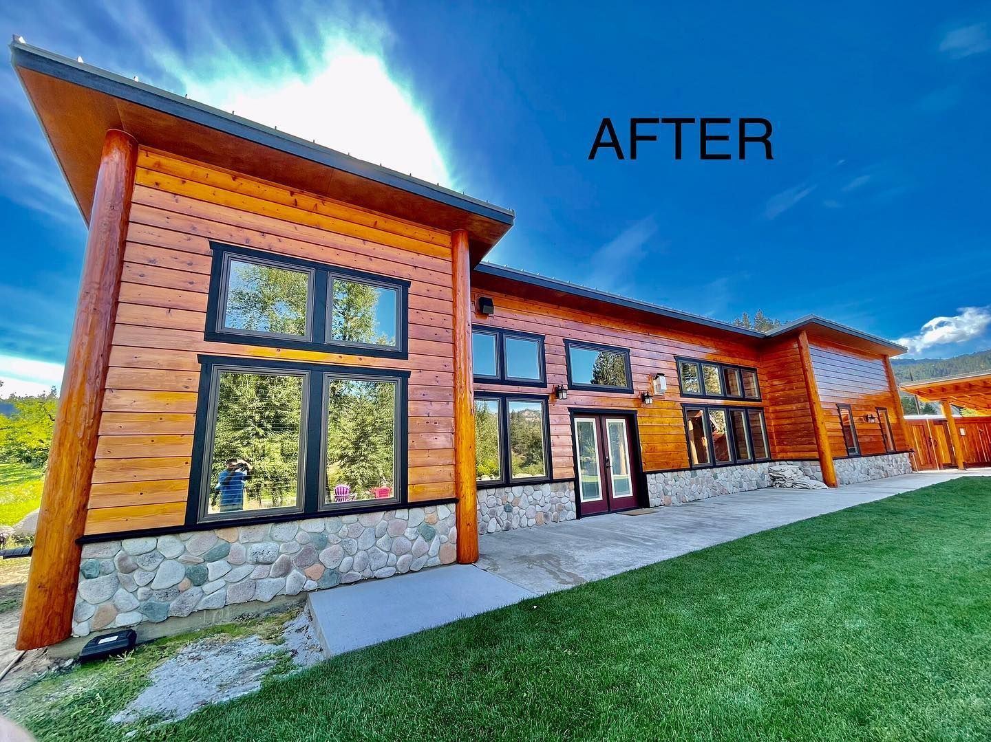 Wood-sided home with a fresh warm stain completed by R Painting