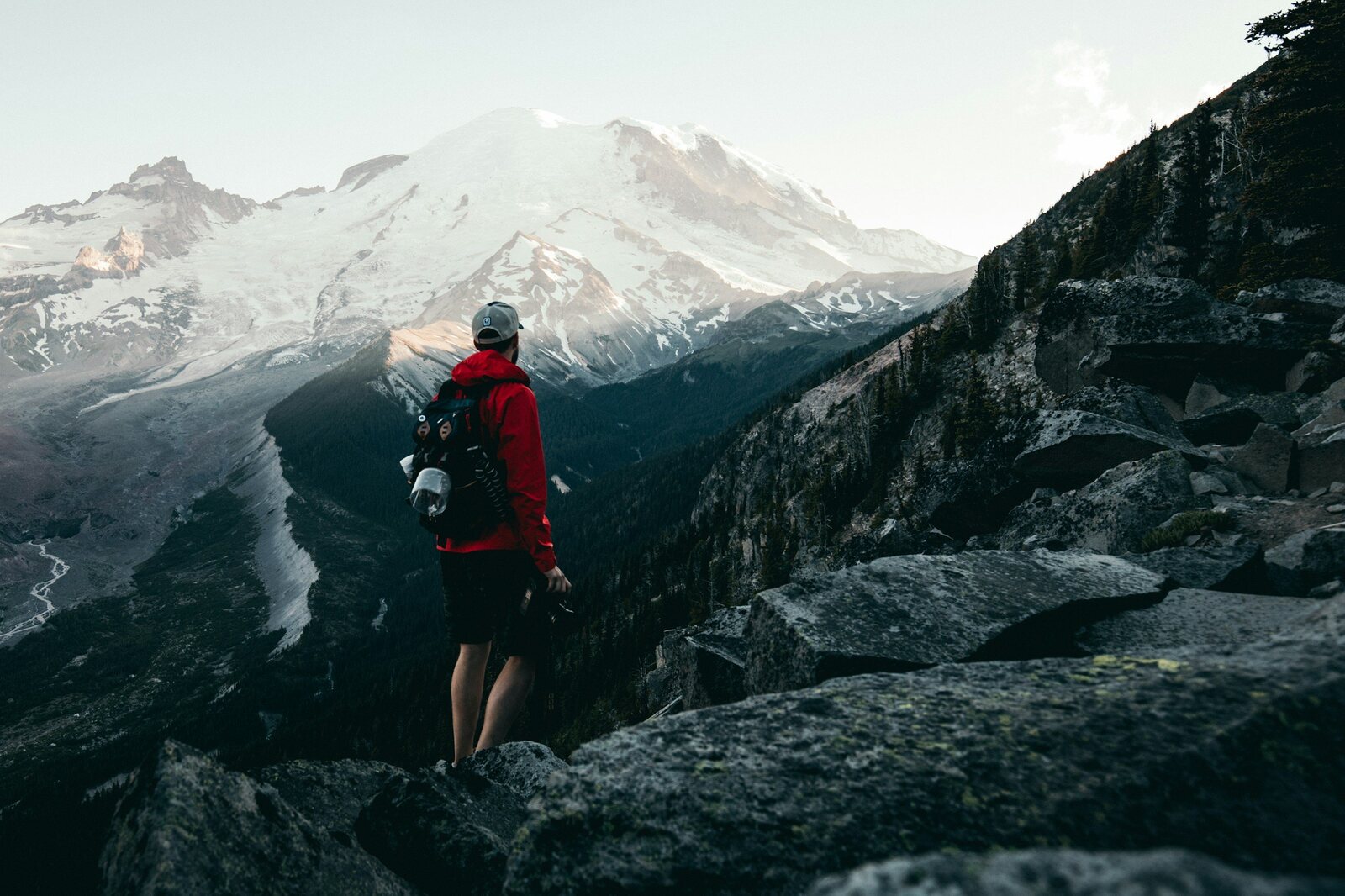 A hiker moving through a mountain landscape