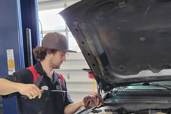 Midvalley Automotive technician working under the hood of a vehicle