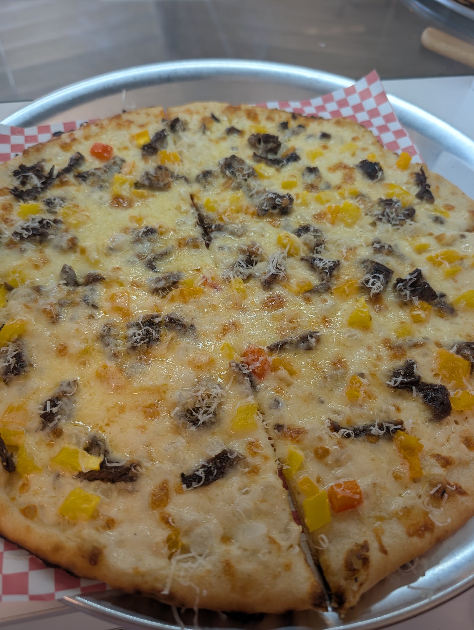 Specialty pizza topped with beef and peppers from The Valley Pizza Joint